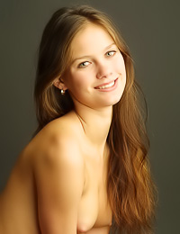 Cute teen gal Ashanti A smiles as she takes off her thongs and exposes her tight bum.