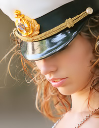 Smoking hot teen chick Natalia B takes off her marine uniform and shows us her tanned body.