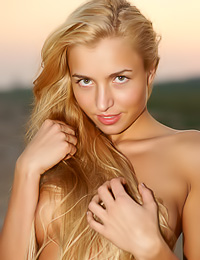 Mishel A: Smoking hot blonde angel Mishel A takes off her sexy dress and shows her huge breasts.